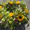 Tröstender Blumenkranz